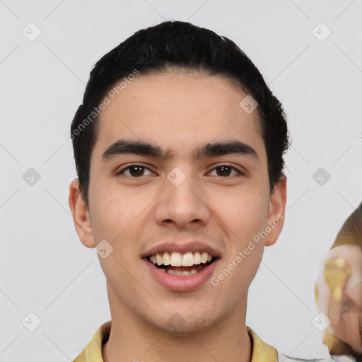 Joyful latino young-adult male with short  black hair and brown eyes