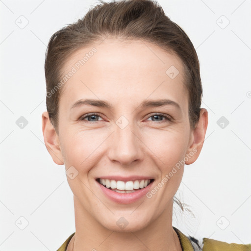 Joyful white young-adult female with short  brown hair and grey eyes