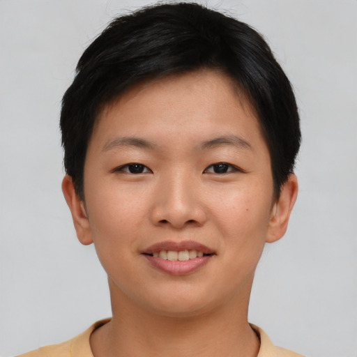 Joyful asian young-adult female with short  brown hair and brown eyes