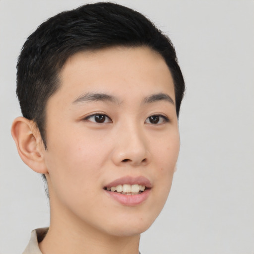 Joyful asian young-adult male with short  black hair and brown eyes