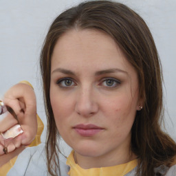 Neutral white young-adult female with medium  brown hair and brown eyes