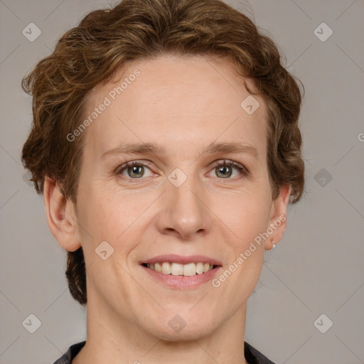 Joyful white adult female with short  brown hair and grey eyes