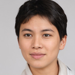 Joyful asian young-adult female with short  brown hair and brown eyes