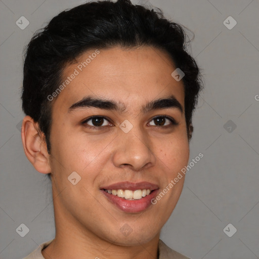 Joyful latino young-adult male with short  brown hair and brown eyes