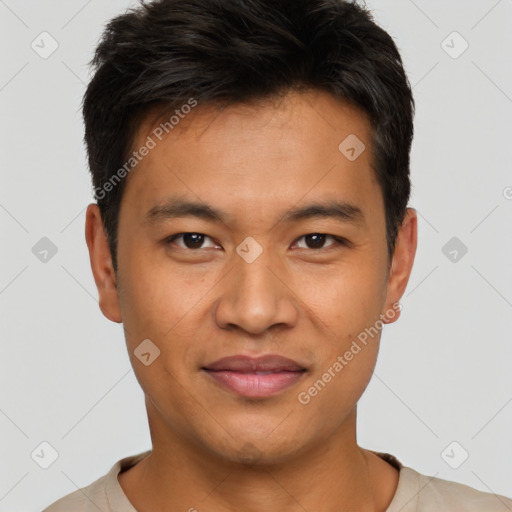 Joyful latino young-adult male with short  brown hair and brown eyes