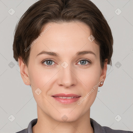 Joyful white young-adult female with short  brown hair and grey eyes