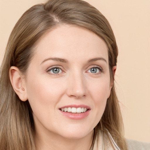 Joyful white young-adult female with long  brown hair and grey eyes