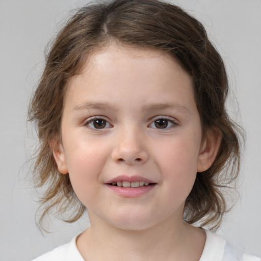 Joyful white child female with medium  brown hair and brown eyes