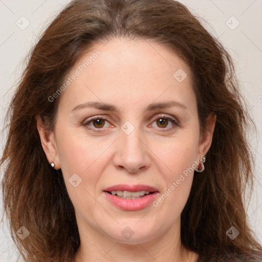 Joyful white adult female with long  brown hair and brown eyes