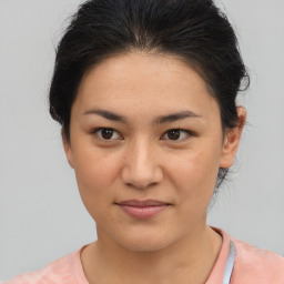 Joyful asian young-adult female with medium  brown hair and brown eyes