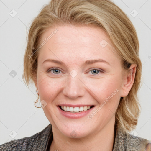 Joyful white young-adult female with medium  brown hair and blue eyes