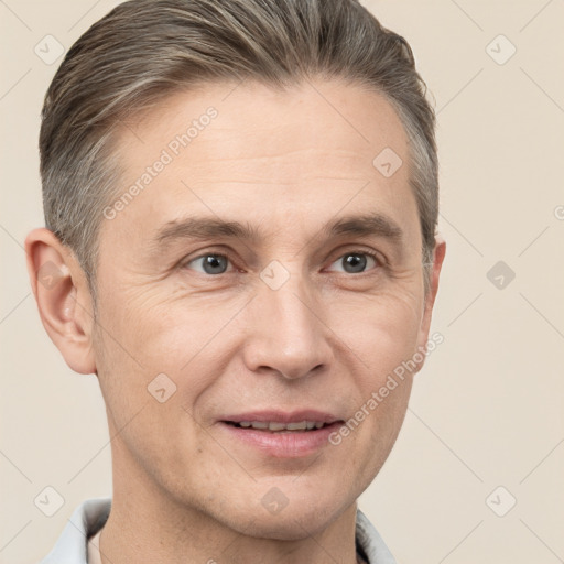 Joyful white adult male with short  brown hair and brown eyes