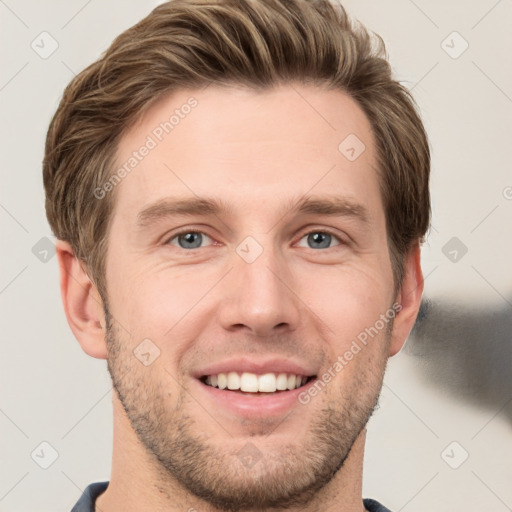 Joyful white young-adult male with short  brown hair and grey eyes