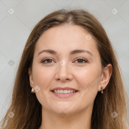 Joyful white young-adult female with long  brown hair and brown eyes