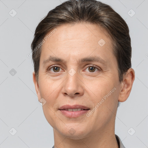 Joyful white adult female with short  brown hair and brown eyes