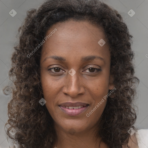 Joyful black young-adult female with medium  brown hair and brown eyes