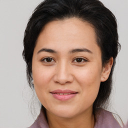 Joyful white young-adult female with medium  brown hair and brown eyes