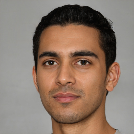 Neutral latino young-adult male with short  black hair and brown eyes