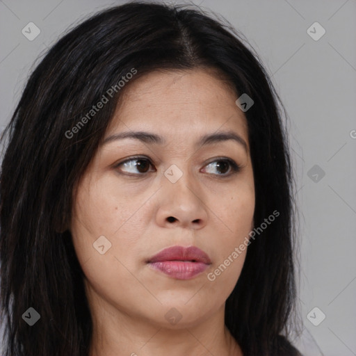 Joyful asian young-adult female with long  brown hair and brown eyes