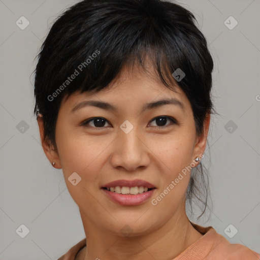 Joyful asian young-adult female with medium  brown hair and brown eyes