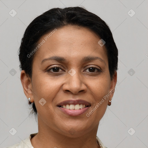 Joyful latino adult female with short  brown hair and brown eyes