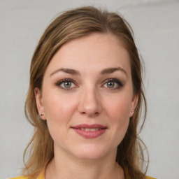 Joyful white young-adult female with medium  brown hair and brown eyes