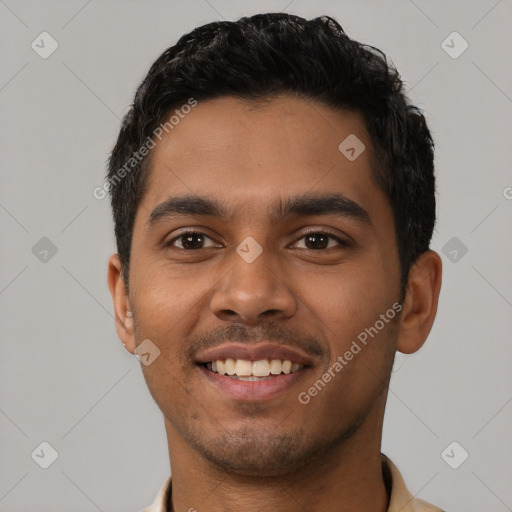 Joyful latino young-adult male with short  black hair and brown eyes