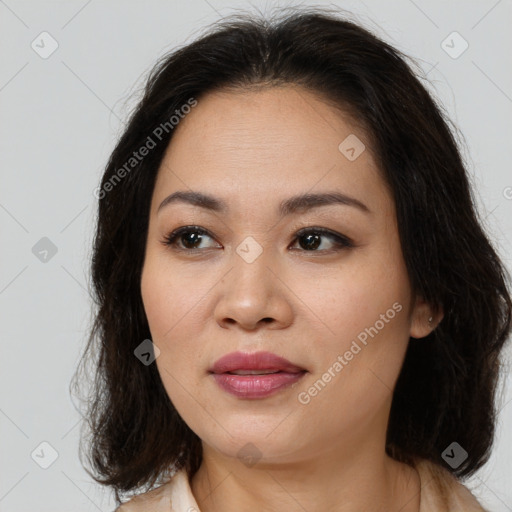 Joyful asian young-adult female with medium  brown hair and brown eyes