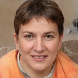 Joyful white adult female with short  brown hair and brown eyes