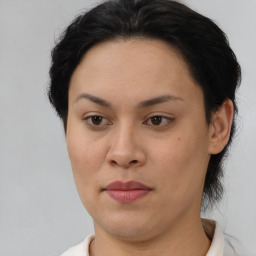 Joyful asian young-adult female with short  brown hair and brown eyes