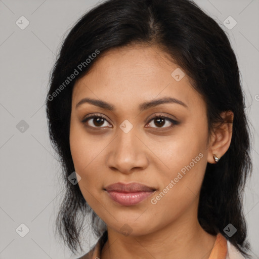 Joyful latino young-adult female with medium  black hair and brown eyes