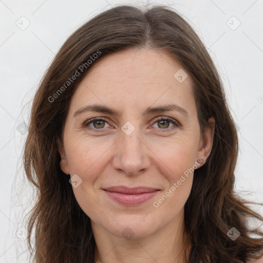 Joyful white adult female with long  brown hair and brown eyes