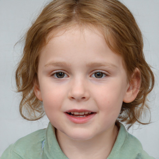 Joyful white child female with medium  brown hair and blue eyes