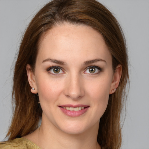 Joyful white young-adult female with medium  brown hair and grey eyes