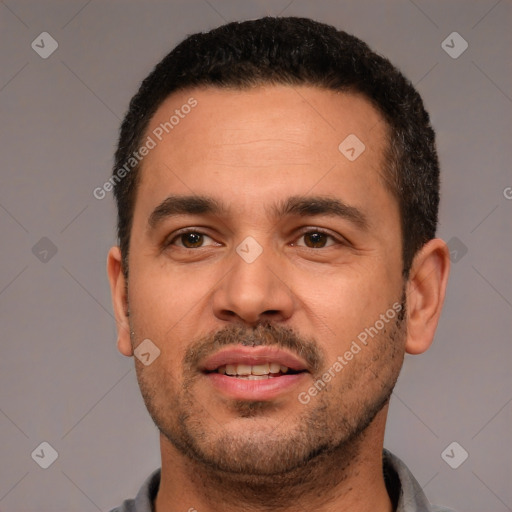 Joyful white young-adult male with short  black hair and brown eyes