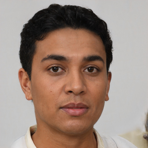 Neutral latino young-adult male with short  brown hair and brown eyes