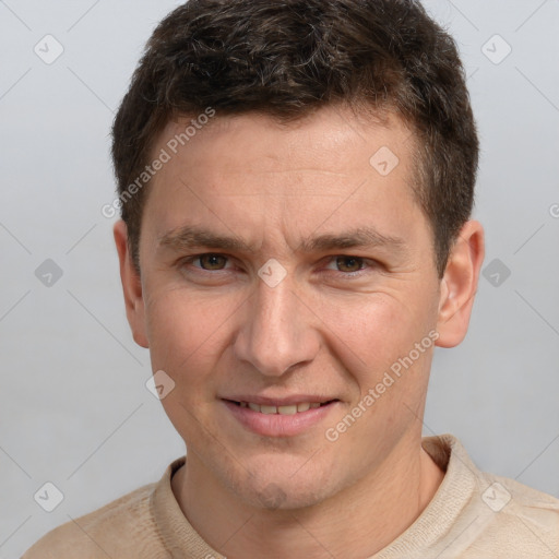 Joyful white adult male with short  brown hair and grey eyes