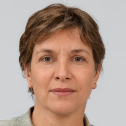 Joyful white adult female with short  brown hair and grey eyes