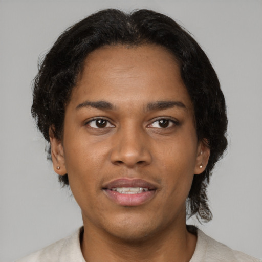 Joyful black young-adult female with short  brown hair and brown eyes