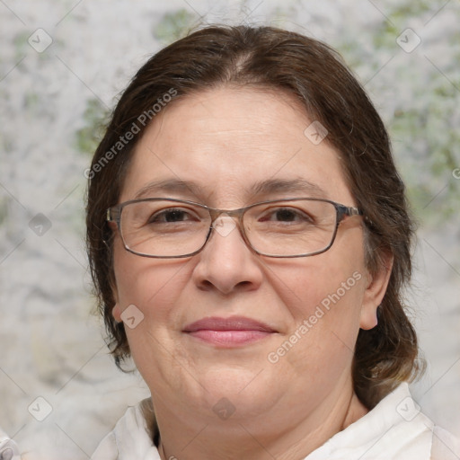 Joyful white adult female with medium  brown hair and blue eyes