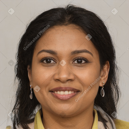 Joyful black adult female with medium  brown hair and brown eyes