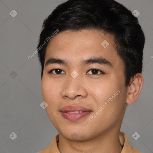 Joyful asian young-adult male with short  brown hair and brown eyes