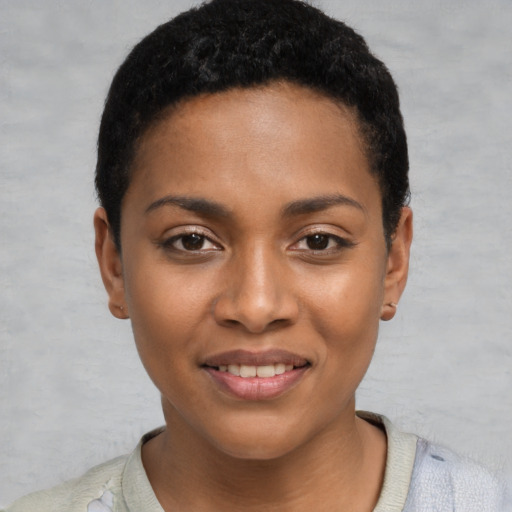 Joyful black young-adult female with short  black hair and brown eyes