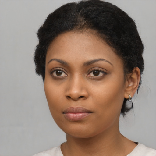 Neutral black young-adult female with short  black hair and brown eyes