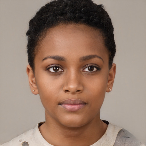 Neutral black child female with short  brown hair and brown eyes
