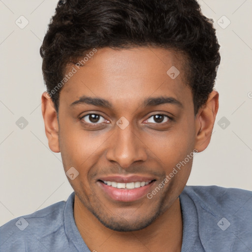 Joyful black young-adult male with short  brown hair and brown eyes