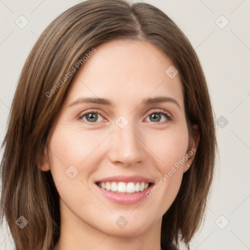 Joyful white young-adult female with long  brown hair and green eyes