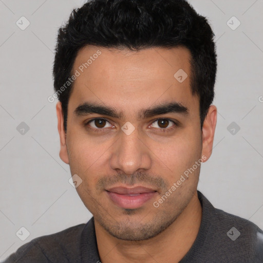 Joyful white young-adult male with short  black hair and brown eyes