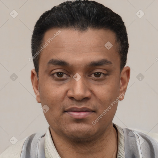 Joyful latino young-adult male with short  black hair and brown eyes