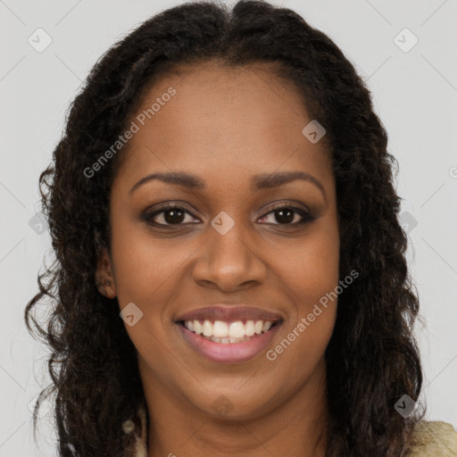 Joyful black young-adult female with long  brown hair and brown eyes